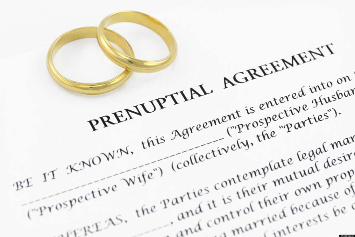 wedding-rings-on-prenuptial-agreement